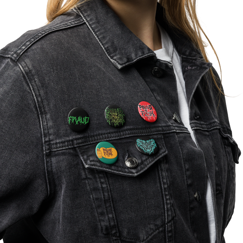 A set of 5 pinds on a jacket with the old logo, new Pound Of Flesh TX logo, Fraud, and Cracker Barrel Design on them